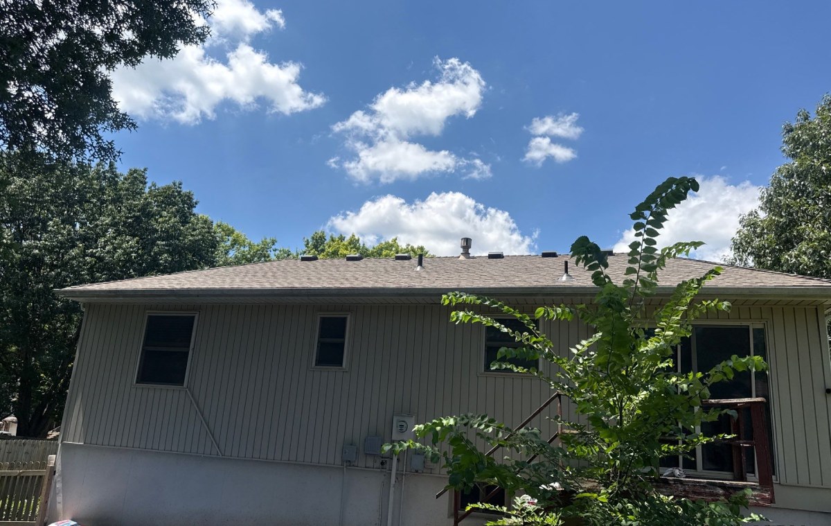 The finished roof: new architectural shingles, new vents, new pipe boots.